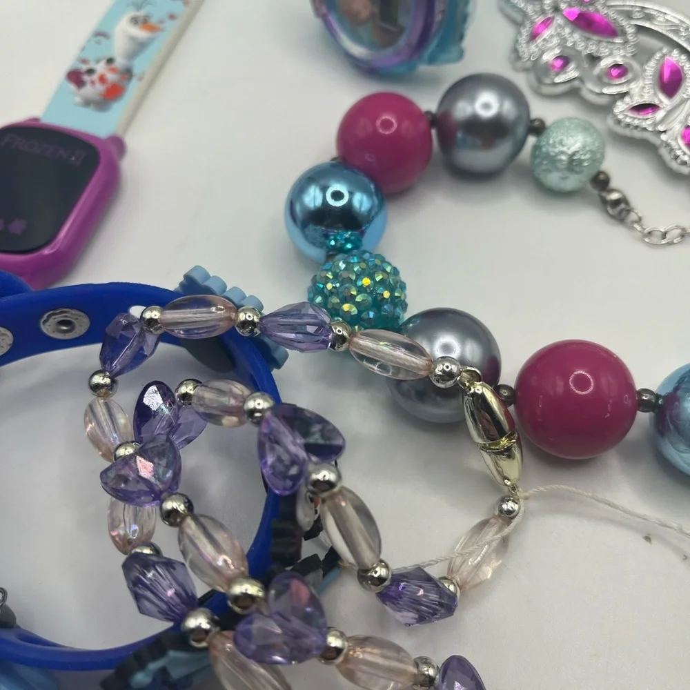 Lot of frozen jewelry from Disney!  Includes working watch